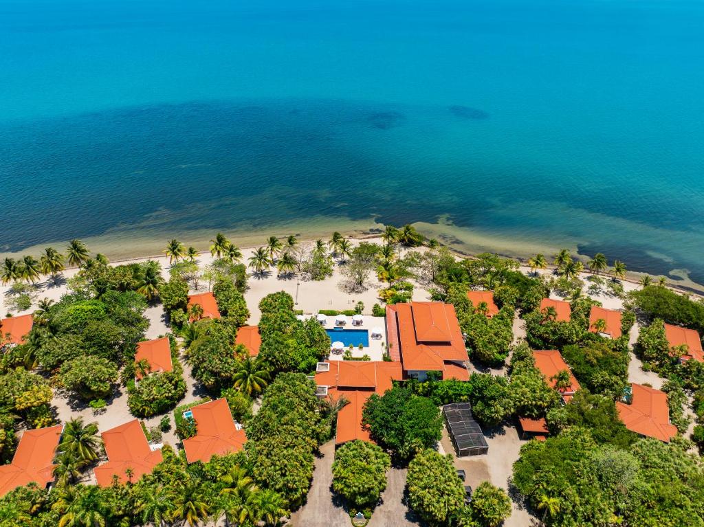 an aerial view of a resort on a beach at Naïa Resort and Spa in Placencia Village