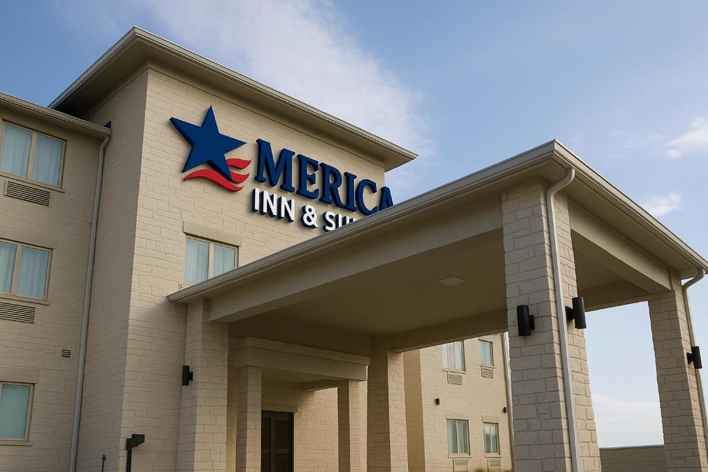 uma placa do Mecca Inn and Suites no topo de um prédio em Merica Inn & Suites em Wills Point