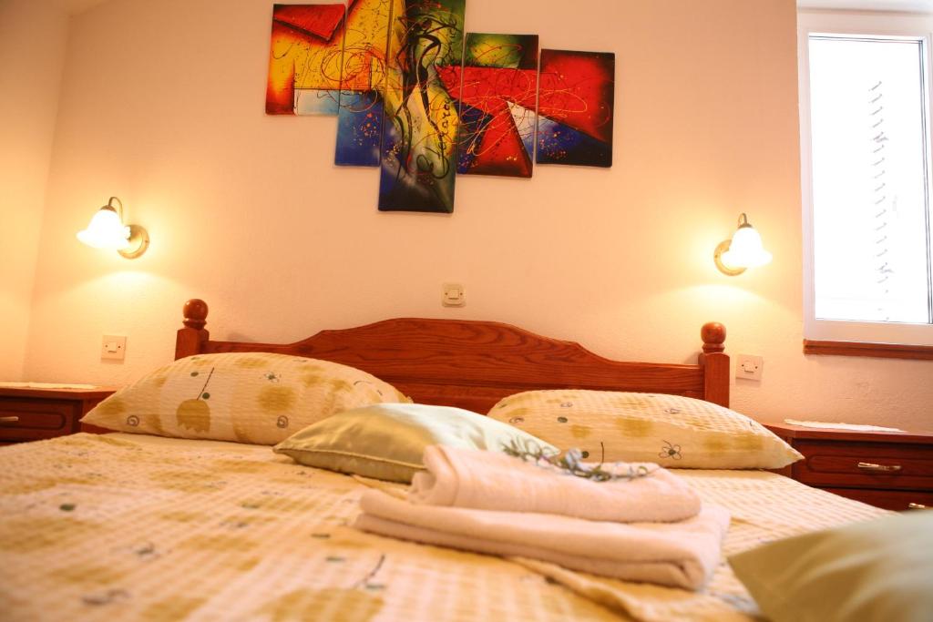 Cama o camas de una habitaci&oacute;n en Bonacic Palace