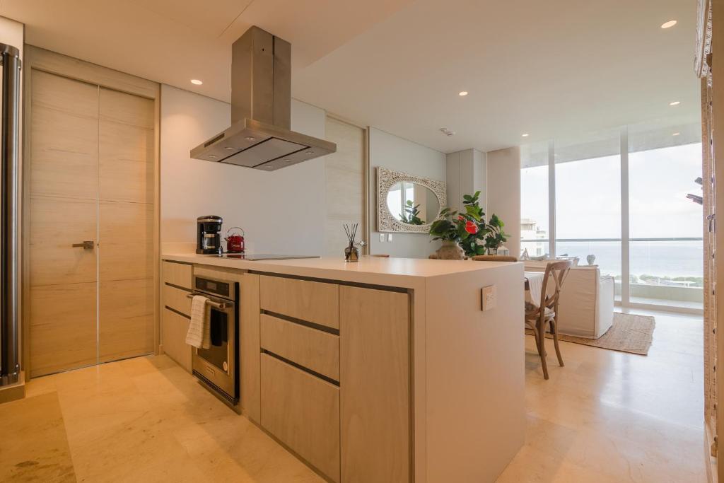 a kitchen with a sink and a counter top at Modern apt with 2 BR BBQ and views in Pendales