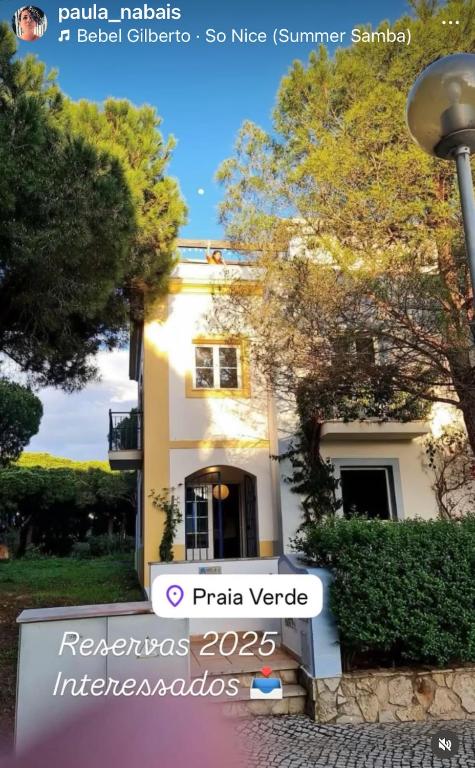 a building with a street sign in front of it at Casa Praia Verde V3 in Castro Marim