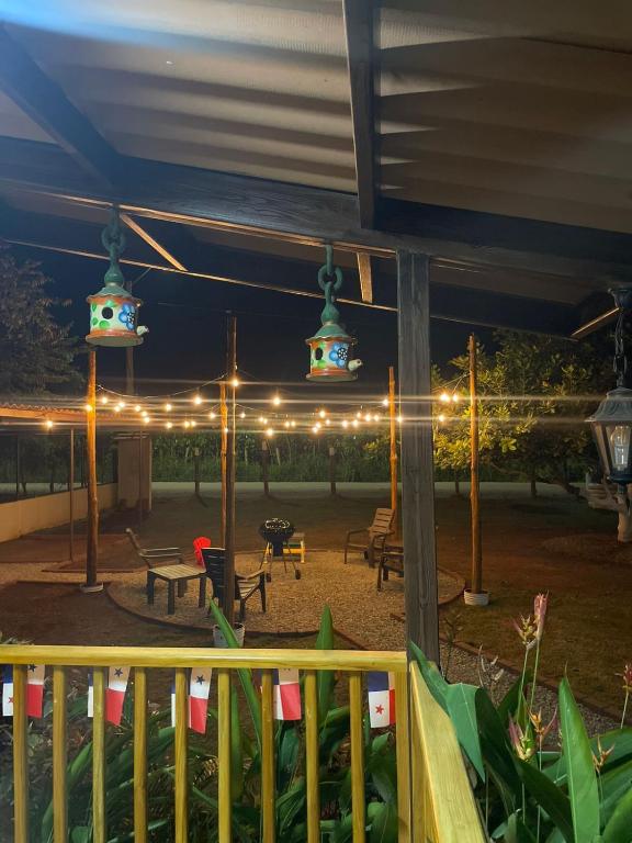 a view of a patio at night with lights at Baruch Tropical Ranch in Los Santos