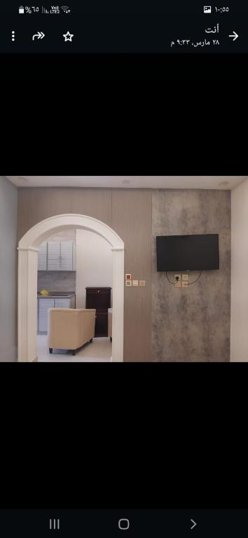 a picture of a living room with a couch and a television at Dar Alfakhama in Al Baha