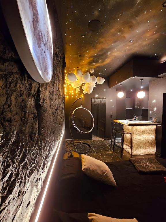 a room with a planet mural on the wall at Suite Intemporelle in Montagnac