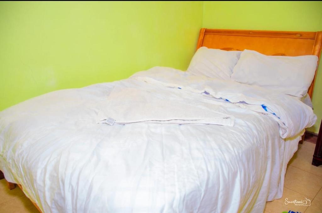 Giường trong phòng chung tại Landmarino hotel