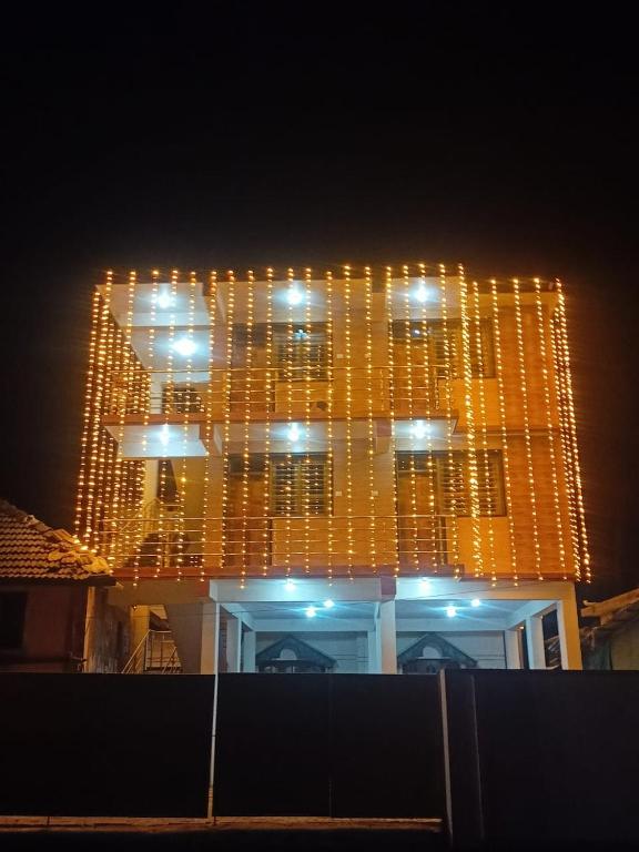 a building with a bunch of lights hanging from it at Annu Mane Homestay in Gokarna