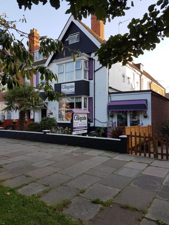 a house with a sign in front of it at The Craigside in Skegness