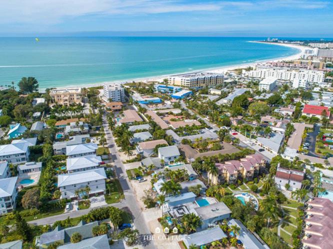 an aerial view of a beach with buildings and the ocean at Azul Resort Siesta Key in Sarasota