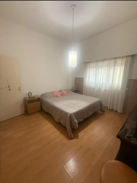 En eller flere senge i et værelse på Mariano decar