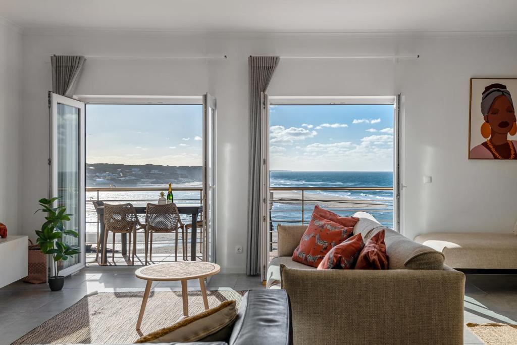 a living room with a view of the ocean at FozPanoramic in Foz do Arelho