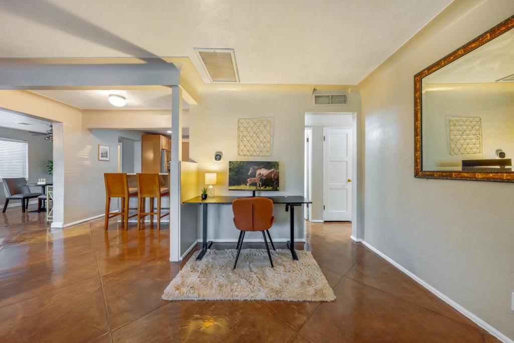 a living room with a table and a mirror at Santa Rita Primary (Mike Morgan) in Tucson