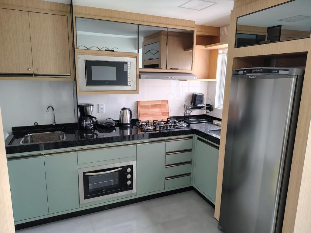 Køkken eller tekøkken på Apto Completo e Aconchegante - Próximo de Tudo