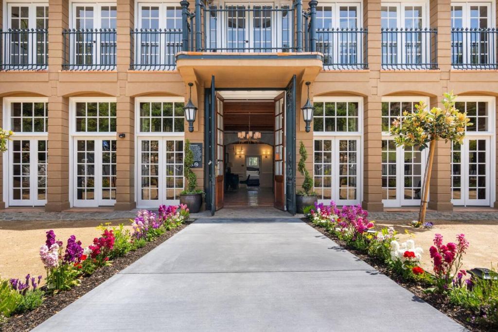 a building with flowers in front of it at Sonoma Stonehouse Hotel in Santa Rosa