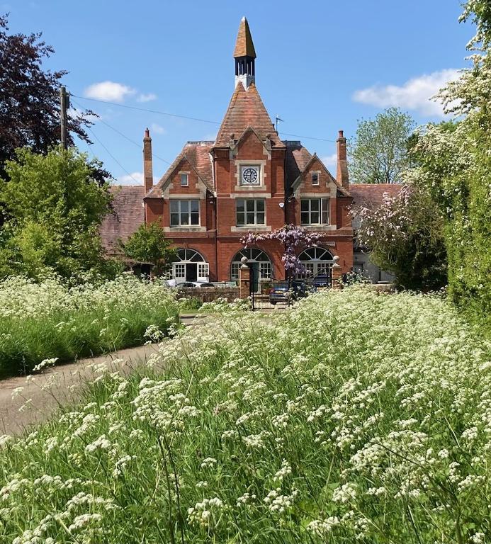 a large brick building with a clock tower on it at The Clock Tower in Daventry