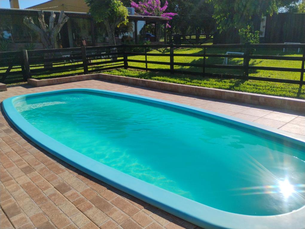 Swimmingpoolen hos eller tæt på Chácara Alci Guedes