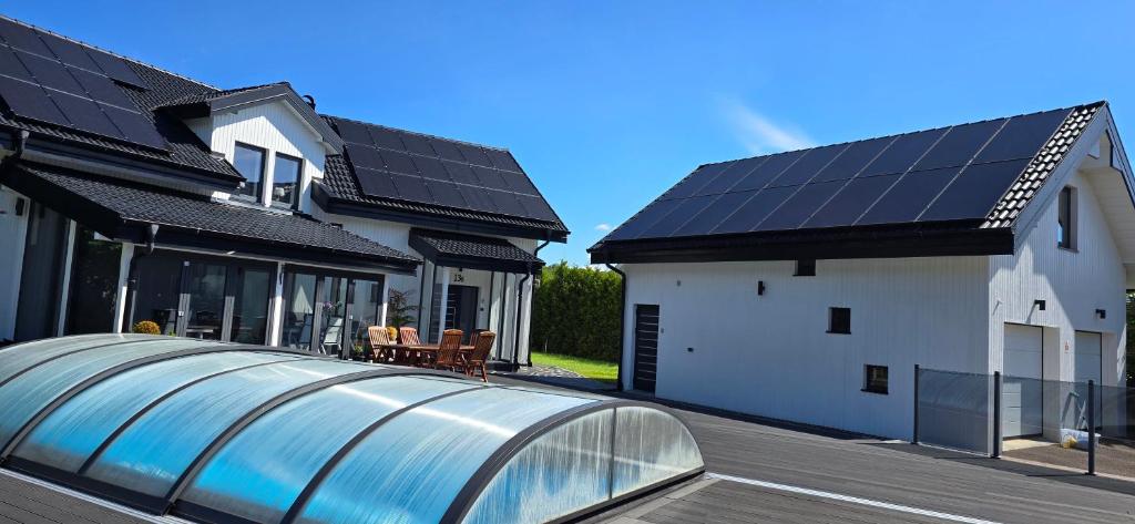 a house with solar panels on the roof at Apartment Feelgood in Billdal