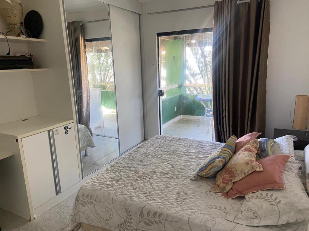 En eller flere senge i et værelse på Mansão Stella Maris