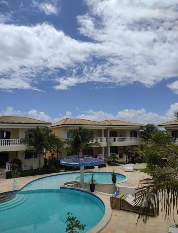 a view of a resort with two pools at Apartamento 218, primeiro andar, Canoa Quebrada in Aracati