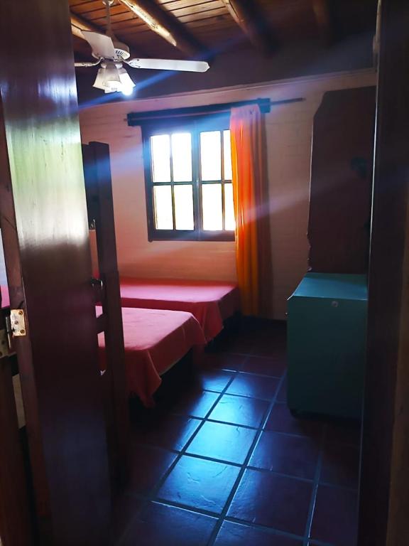 Ένα ή περισσότερα κρεβάτια σε δωμάτιο στο Caburé