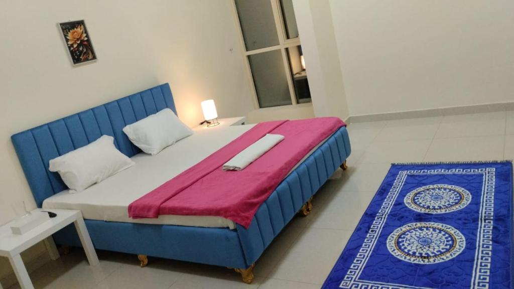 Ένα ή περισσότερα κρεβάτια σε δωμάτιο στο Texico Alkhuwir Muscat