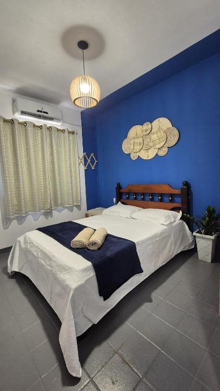 En eller flere senge i et værelse på Ap Beach House 001 - Cond Cais da Sagração - Angelim