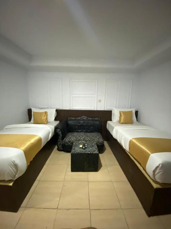 Una cama o camas en una habitación de My Home Cibubur