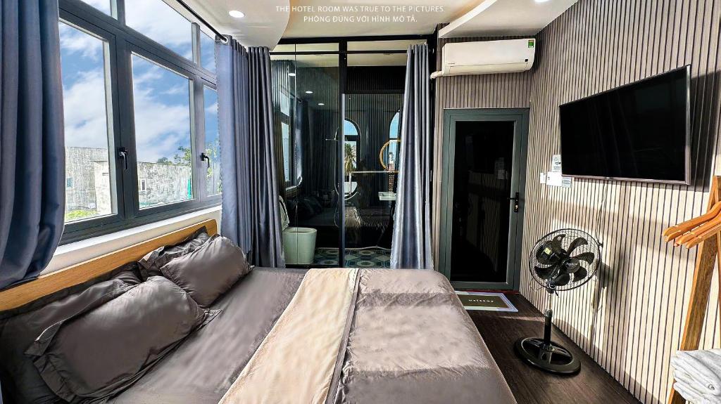 TV a/nebo společenská místnost v ubytování Khách Sạn MINTNACIE