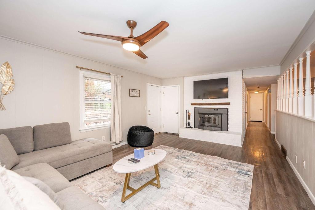 a living room with a couch and a ceiling fan at The Terrace Timber House For 8 in Hamilton