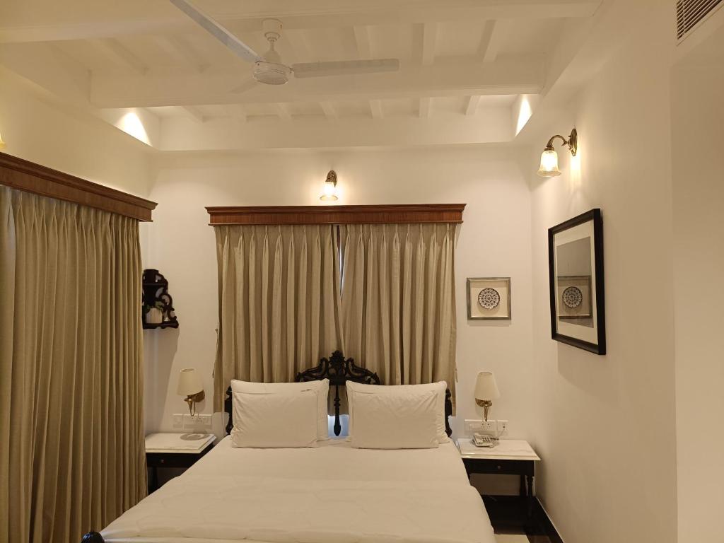 En eller flere senge i et værelse på The Ant Hill