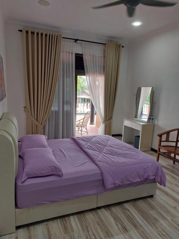 En eller flere senge i et værelse på Salsabeela Guesthouse