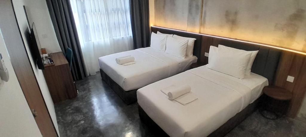 Postel nebo postele na pokoji v ubytování Muari Boutique Hotel