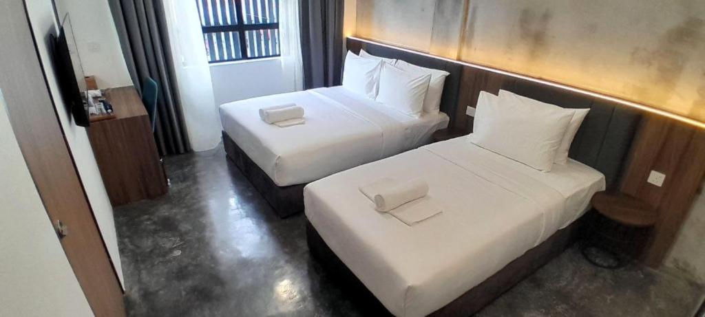 Postel nebo postele na pokoji v ubytování Muari Boutique Hotel