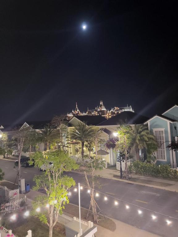 a view of a street at night with a cruise ship at Villa Giọt Nắng Phan Thiết in Phan Thiet