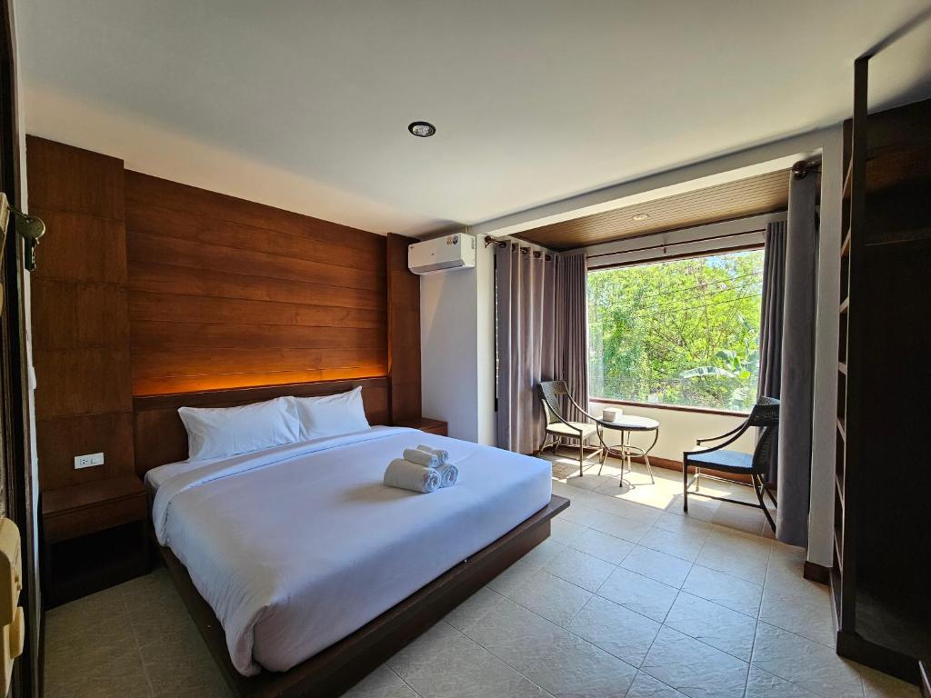 Ένα ή περισσότερα κρεβάτια σε δωμάτιο στο Anda See Hotel