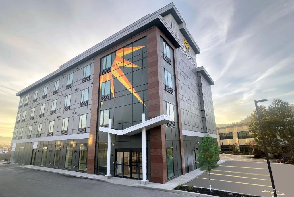 a building with a painting on the side of it at La Quinta Inn & Suites by Wyndham Kelowna BC in Kelowna