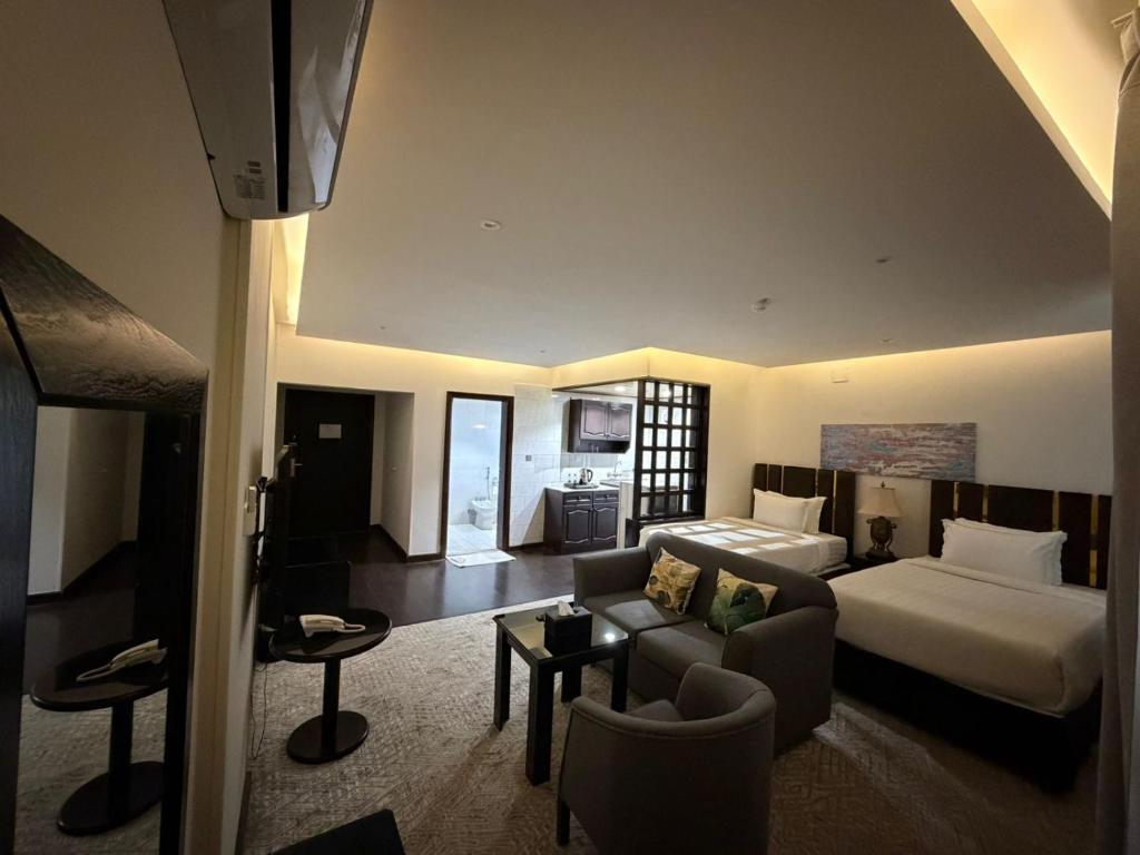 Postel nebo postele na pokoji v ubytování ايوان التميز للشقق الفندقية- Ewan Altamayoz Hotel Apartment