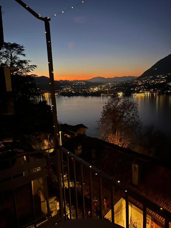 a view of a body of water at sunset at Sunset Lake Como con balcone vista lago in Blevio