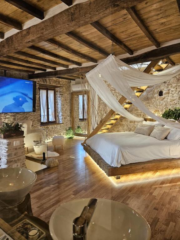 a bedroom with a bed with a hammock in it at La Nuit d'Amélie 2 in Norma