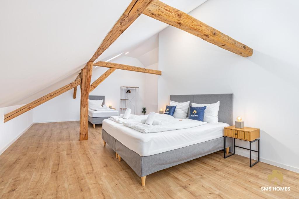 En eller flere senge i et værelse på SMS-Homes I Auszeit am See #2