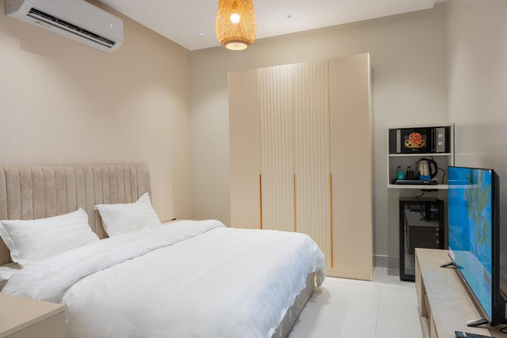 En eller flere senge i et værelse på سمو - 101 OrbitNet JED1