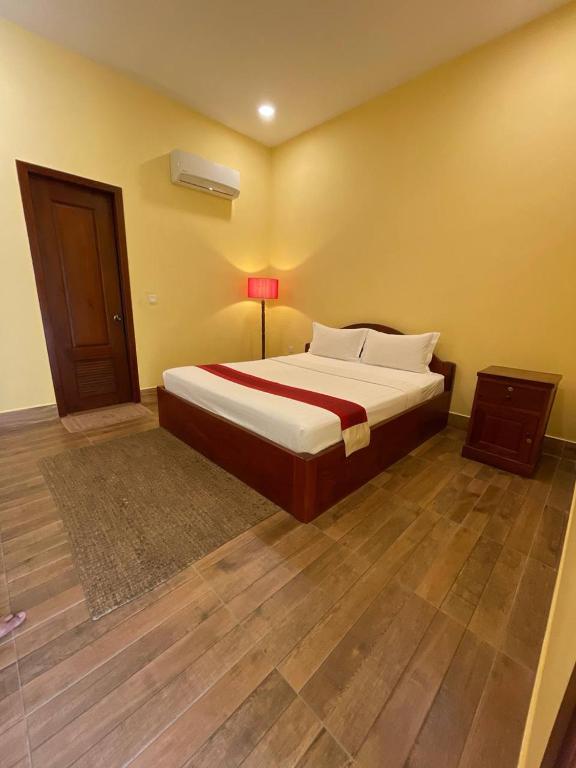 Llit o llits en una habitació de Maam Guesthouse