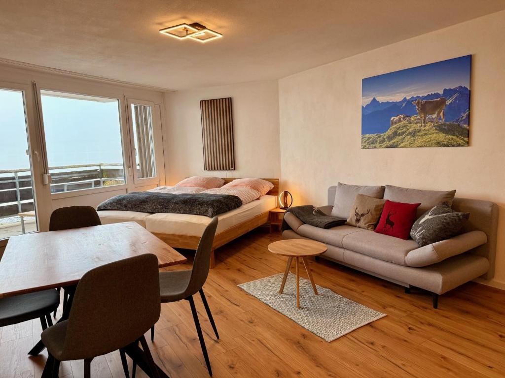 Et opholdsområde på AlpinLounge Scheidegg - Studio mit Wellness und Bergblick