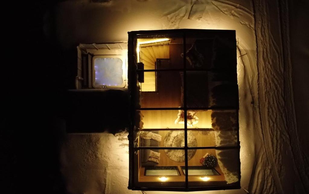 a mirror on the side of a wall in a room at Levi Lapland Luxury Igloos D in Levi