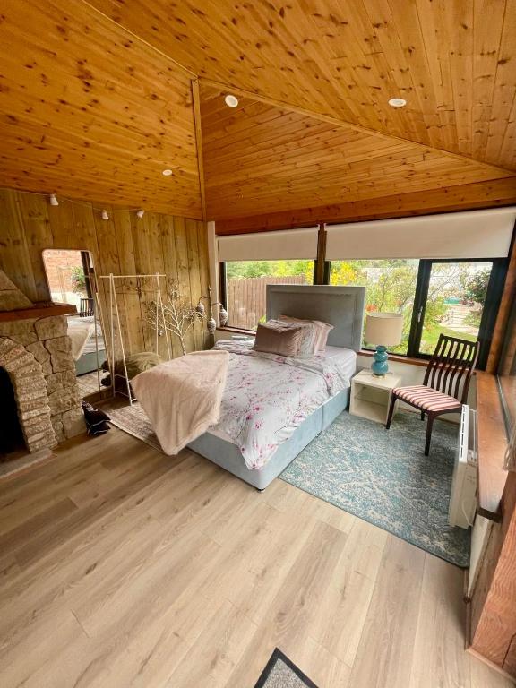 a bedroom with a bed and a wooden ceiling at Garden Room Malahide in Malahide