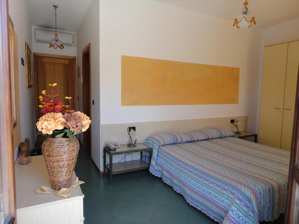 Postel nebo postele na pokoji v ubytování Hotel Silvestrino