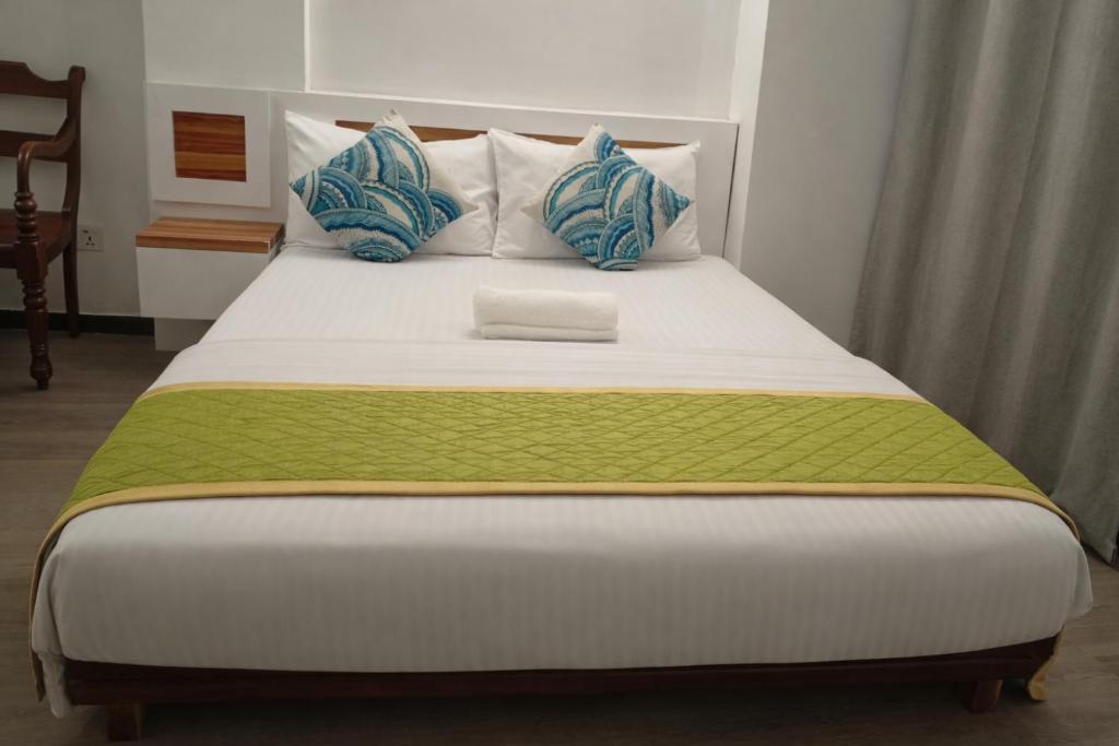 Postel nebo postele na pokoji v ubytování Male City Stay