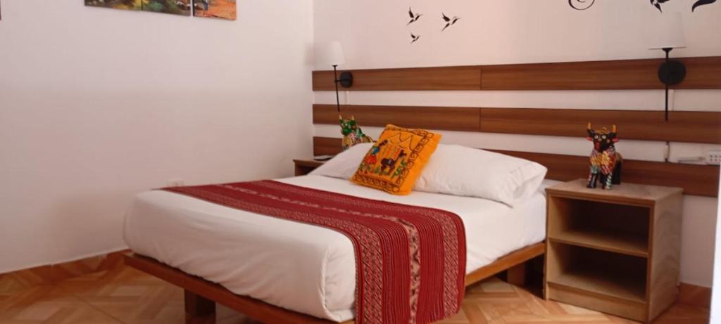 En eller flere senge i et værelse på Hotel all sur