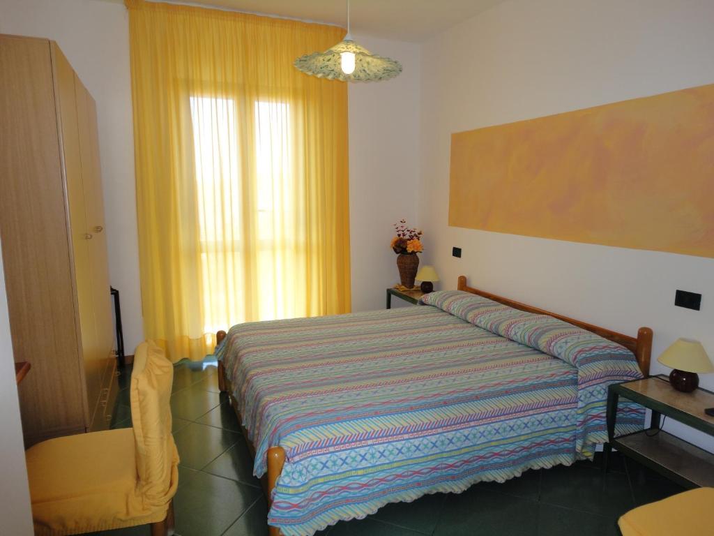 Postel nebo postele na pokoji v ubytování Hotel Silvestrino