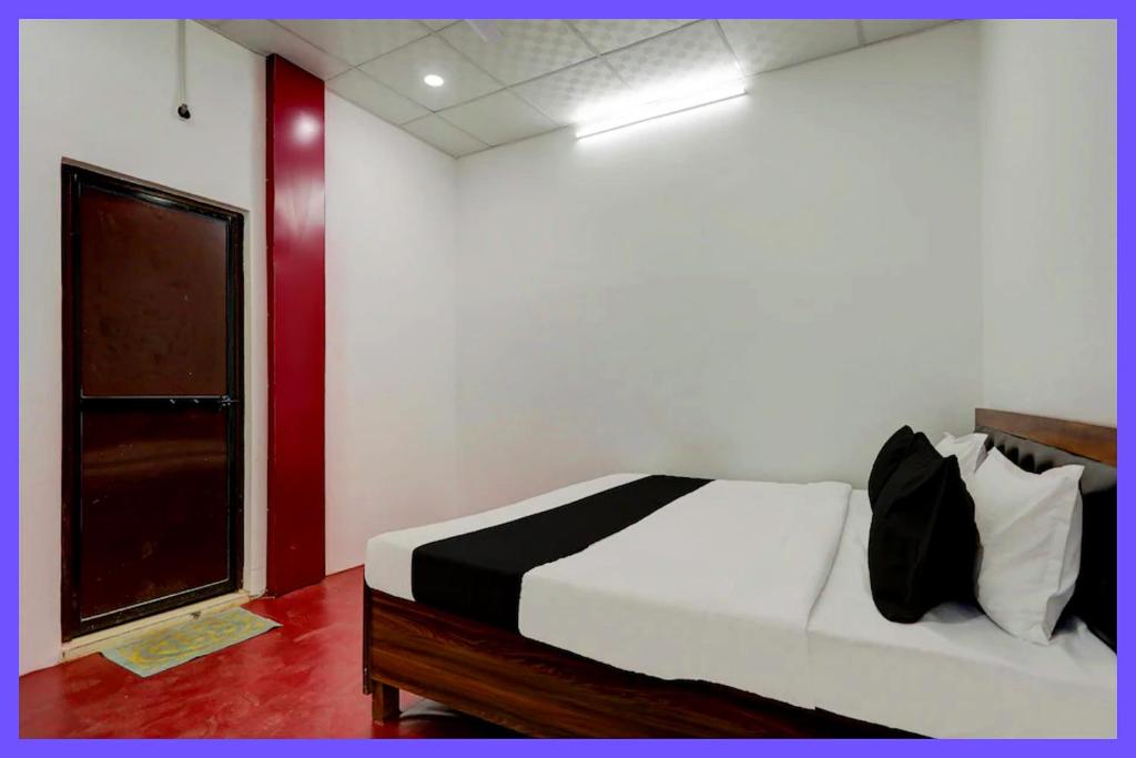 Voodi või voodid majutusasutuse Sattvikam Premium Inn toas