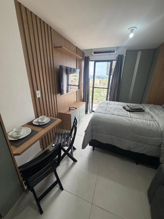 Giường trong phòng chung tại Flat Super Elegante em Bairro Nobre